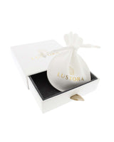 White Lustora gift box and jewelry pouch with gold metallic logo