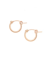 Rose Gold Mini Huggie Hoops on a White Background