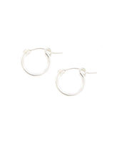Sterling Silver Mini Huggie Hoops on a White Background
