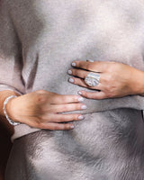 Close up of a Model Wearing a Silver Paperclip Bracelet