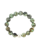 Green Lustora Bianca Stretch Bracelet with African Turquoise stones on a white background