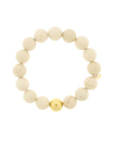 Lustora Bianca Stretch Bracelet with Riverstone Jasper stones and gold bead accent on a white background