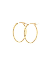 Large 14k gold-filled Cami Oval Hoops on a white background