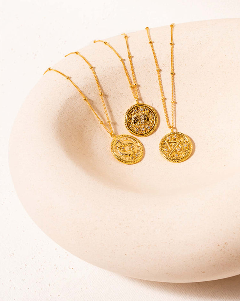 Three Zodiac Necklaces in a Bowl