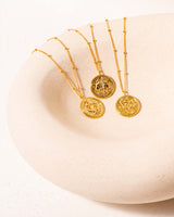 Three Zodiac Necklaces in a Bowl