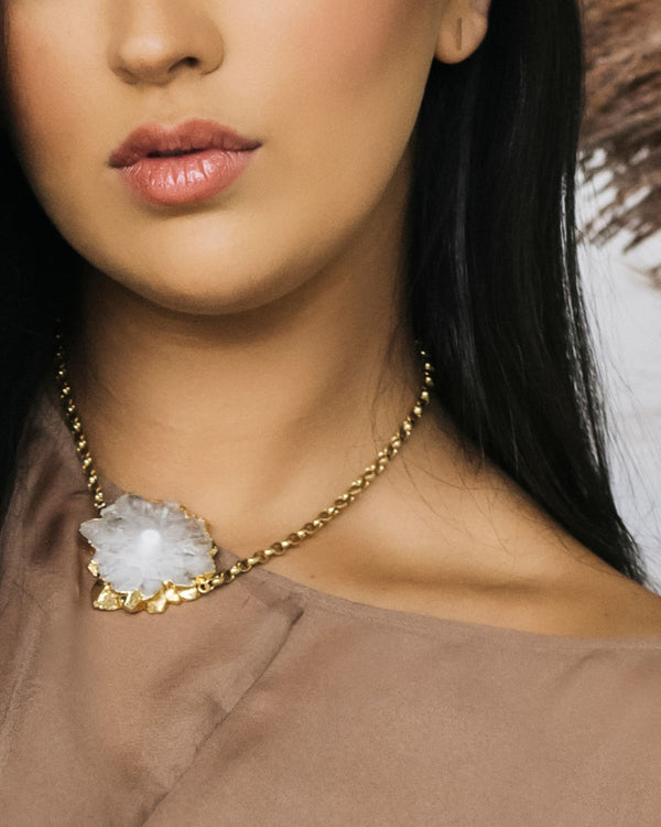 Close up of Zuri Solar Quartz necklace on model